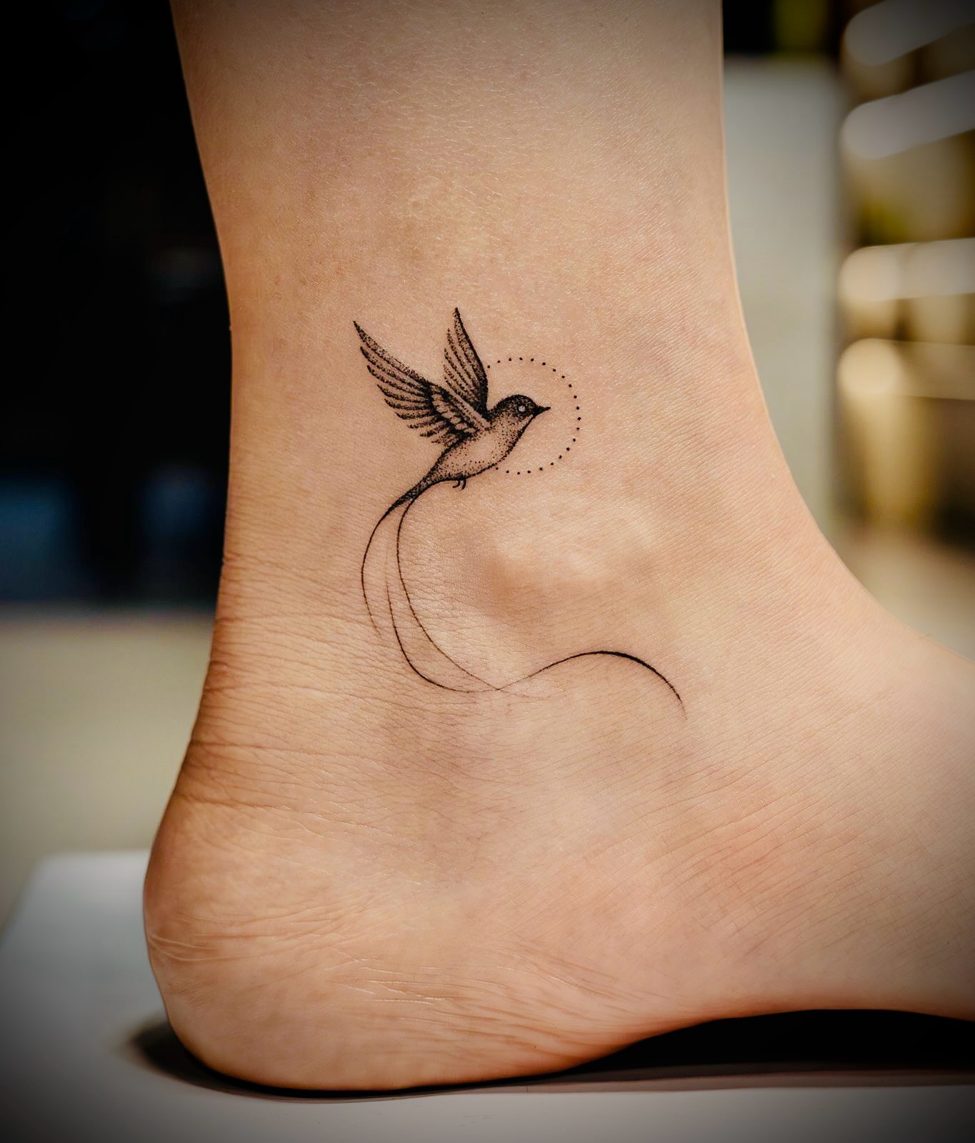 Bird on Ankle Tattoo